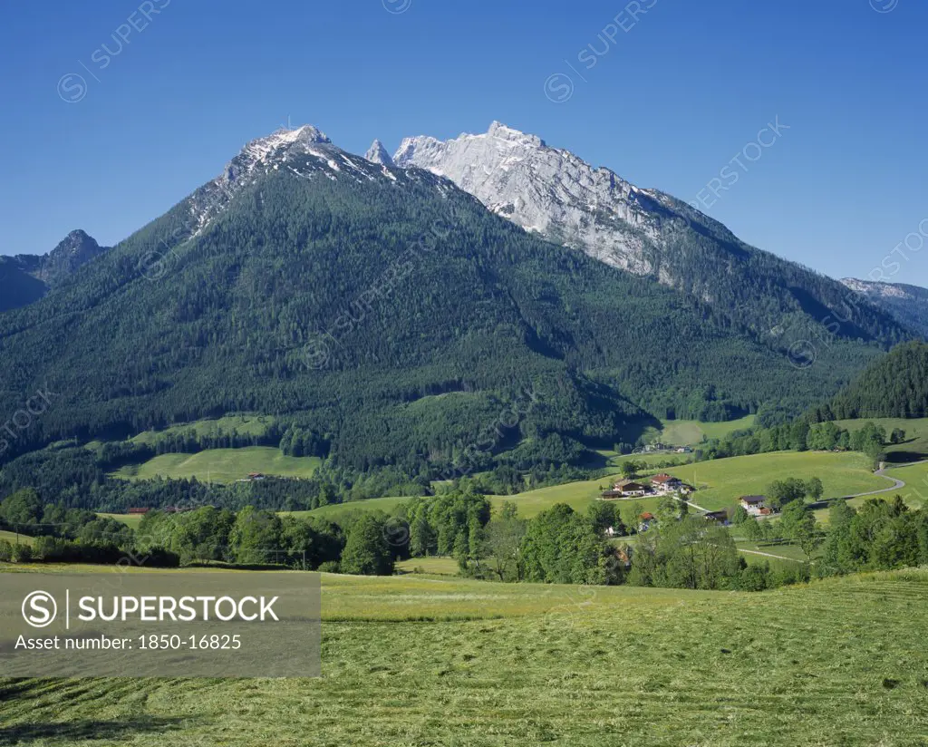 Germany, Berchtesgaden, Hockkalter From Above Ramsau. Mountain Surrounded By Grassy Fields.