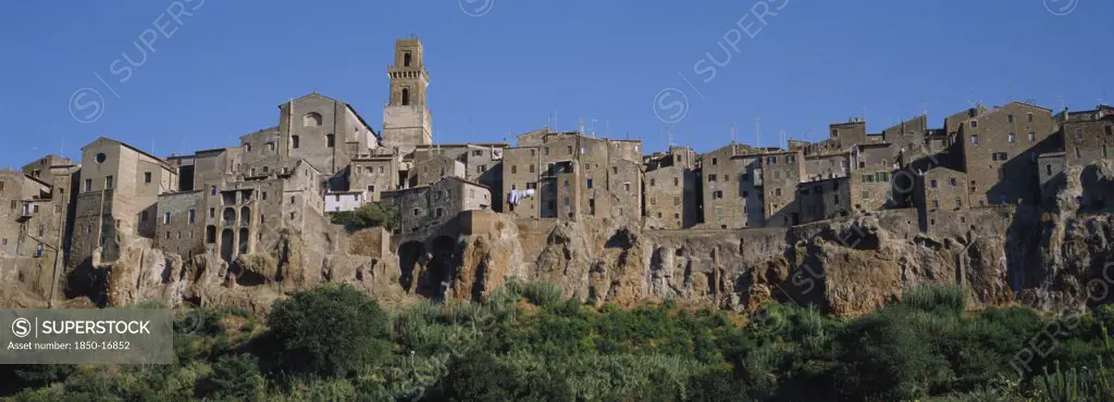 Italy, Tuscany, Town Of Pitigliano, Built On Cliffs Above Lente Valley With Caves Made During Etruscan Era.