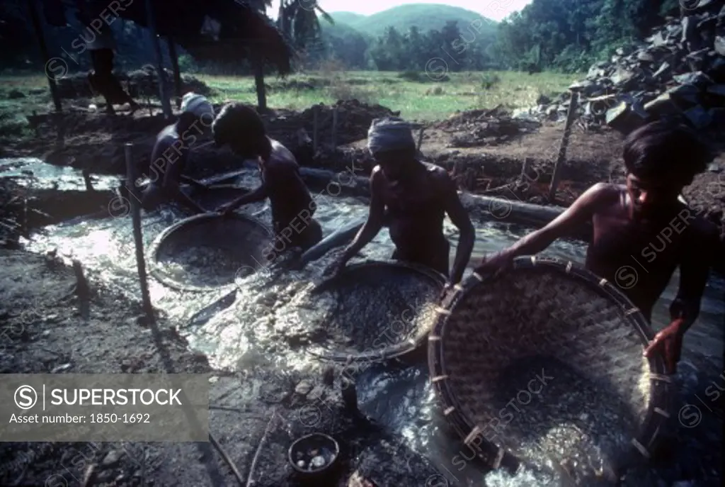 Sri Lanka, Ratnapura, Men Panning For Gems In A Gem Mine