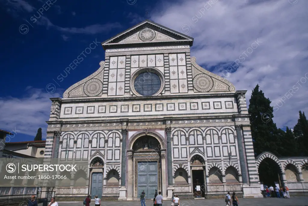 Italy, Tuscany, Florence, Santa Maria Novella Exterior Facade With Geometric Design And Central Circular Window.