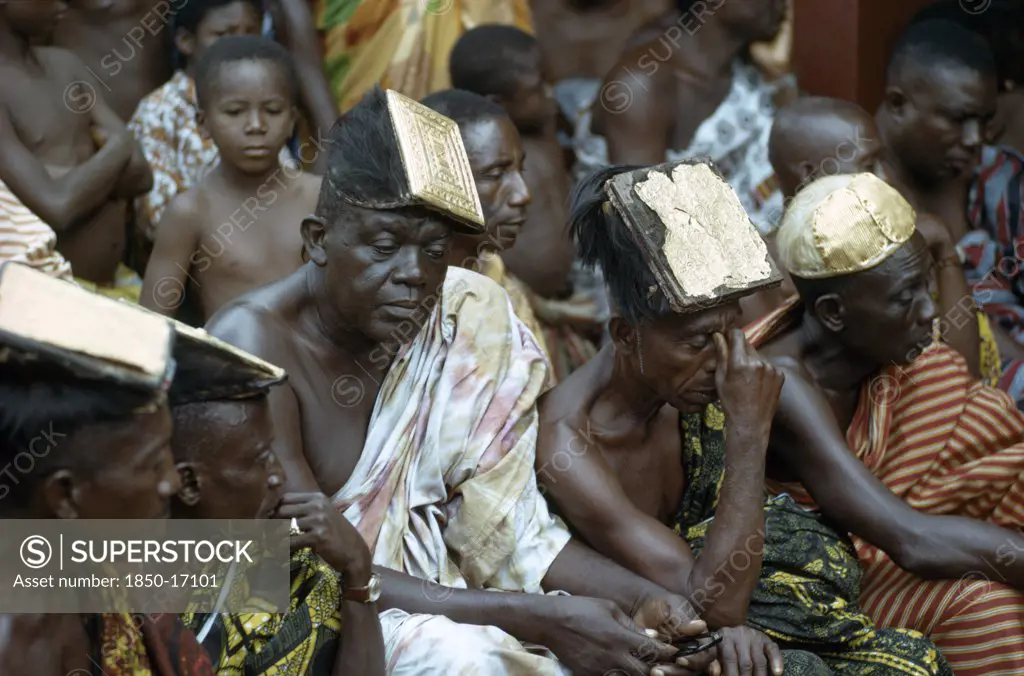 Ghana, Tribal People, Ashanti Elders Wearing Traditional Headdresses Decorated With Gold At Tribal Meeting.