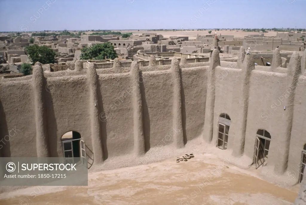 Mali, Sahel, Djenne, Courtyard Of The Grand Mosque And Rooftops Of Town Beyond.