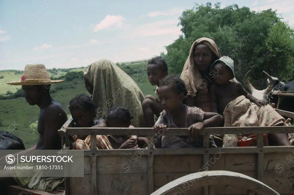 Madagascar, Central, People, Family Travelling In Wooden Ox Cart.