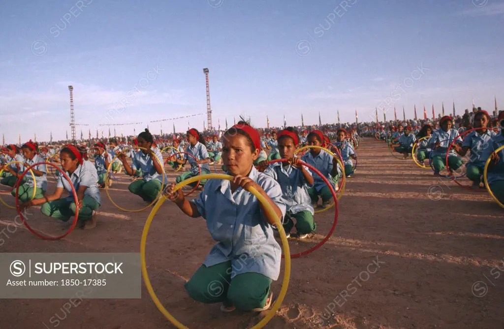 Western Sahara, Sadr, 'Parade Of Children With Coloured Hoops Celebrating Anniversary Of The Polisario Front, The Sahrawi Movement Working Towards Independence.'