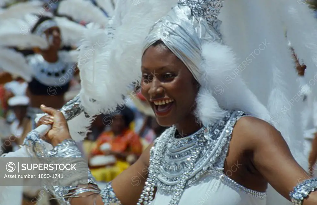 West Indies, Barbados, Crop Over, Woman In Silver And White Costume At Traditional Harvest Festival To Celebrate Bringing In The Sugar Cane Crop
