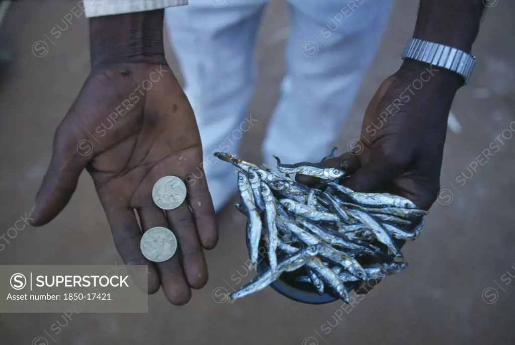 Malawi, Mulanje, Micro-Credit Loan.  Cropped Shot Of Peter Makfero Hamilton Who Travels To Lake Malawi To Buy Fish To Resell In Business Started Using Money Lent By His Village Credit Union.