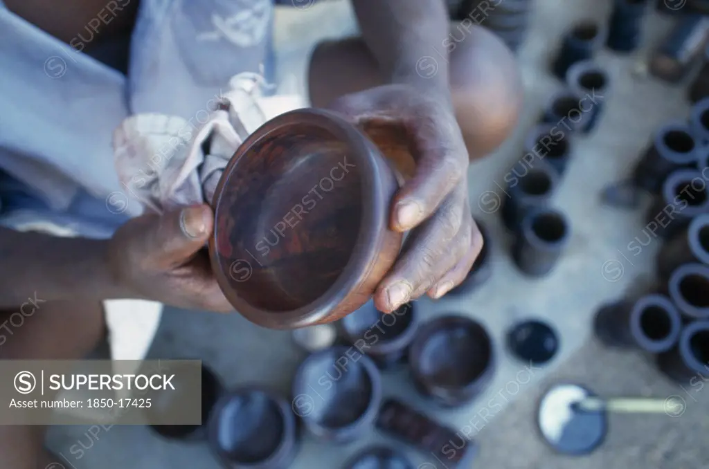 Malawi, Zalewa, Kadzuwa Crafts.  Cropped View Of Craftsman Producing Fair Trade Carved Items For Export.