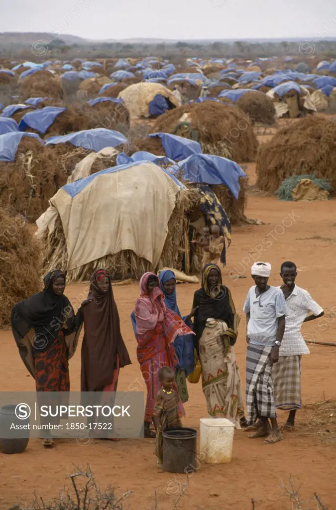 Kenya, Mandera, 'Somali Refugee Camp Run By Unhcr With A Population Of 55,000.  People Waiting For Water With Tents Spread Out Behind.'