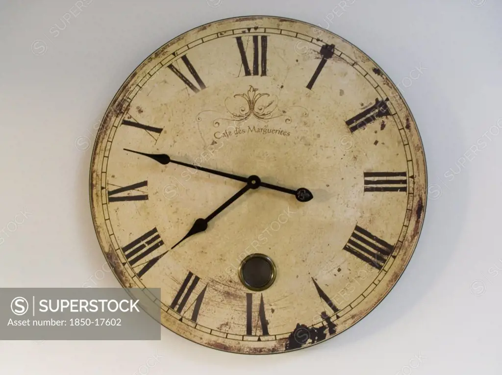 France, Deux Sevres Region, Poitiers, A Classic Clock Face With Roman Numerals Against A Plain Background.