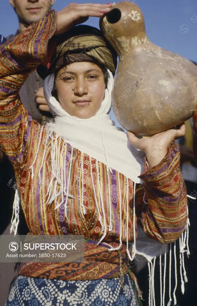Turkey, East, Young Woman Carrying Calabash Gourd For Water.