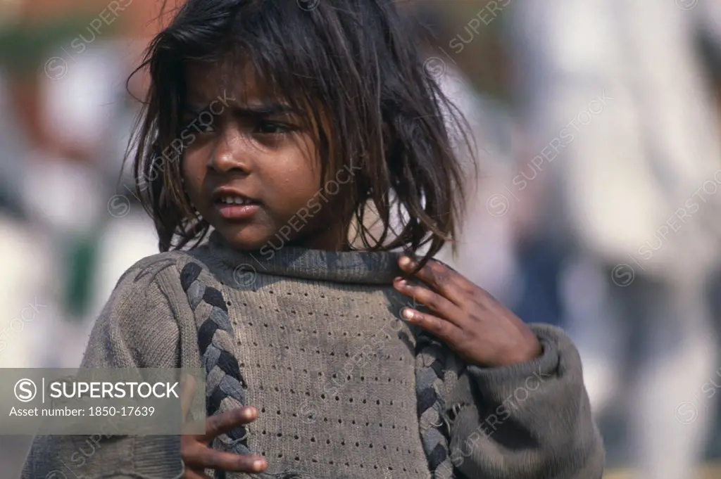 India, Delhi, 'Portrait Of Young Street Girl Wearing Dirty,Oversized Jumper.  Rtnd 2 Vkb 15/5/2009'