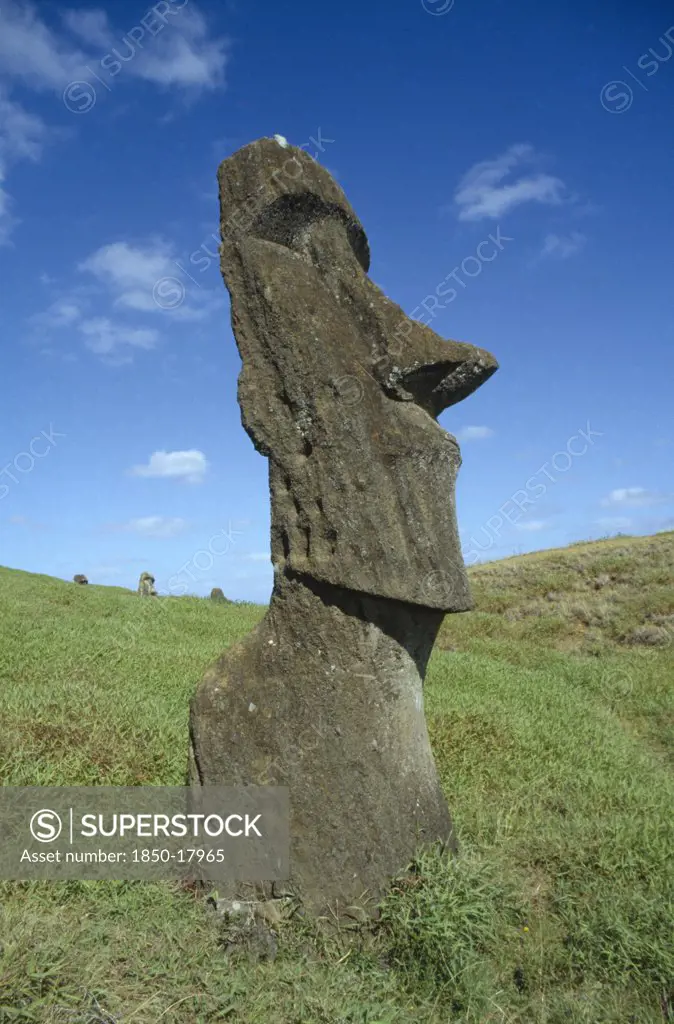 Pacific Islands, Easter Island, Rano Raraku Crater. Large Monolith Moai Head Statue On The Slopes Of Crater