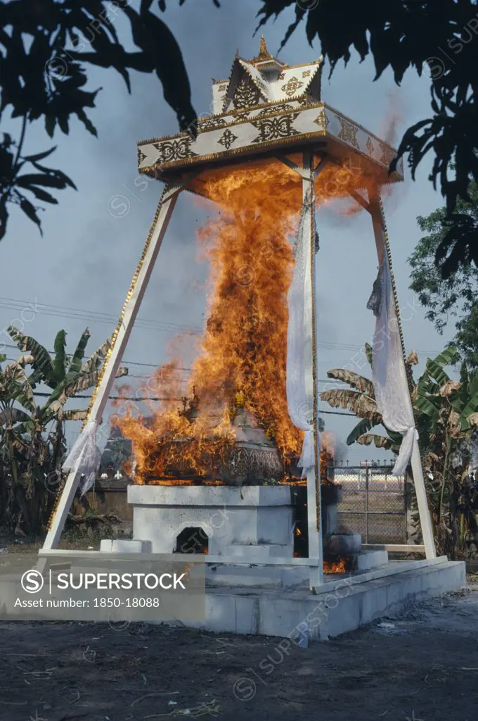 Laos, Vientiane, Funeral Pyre Engulfed In Flames At A Buddhist Cremation.