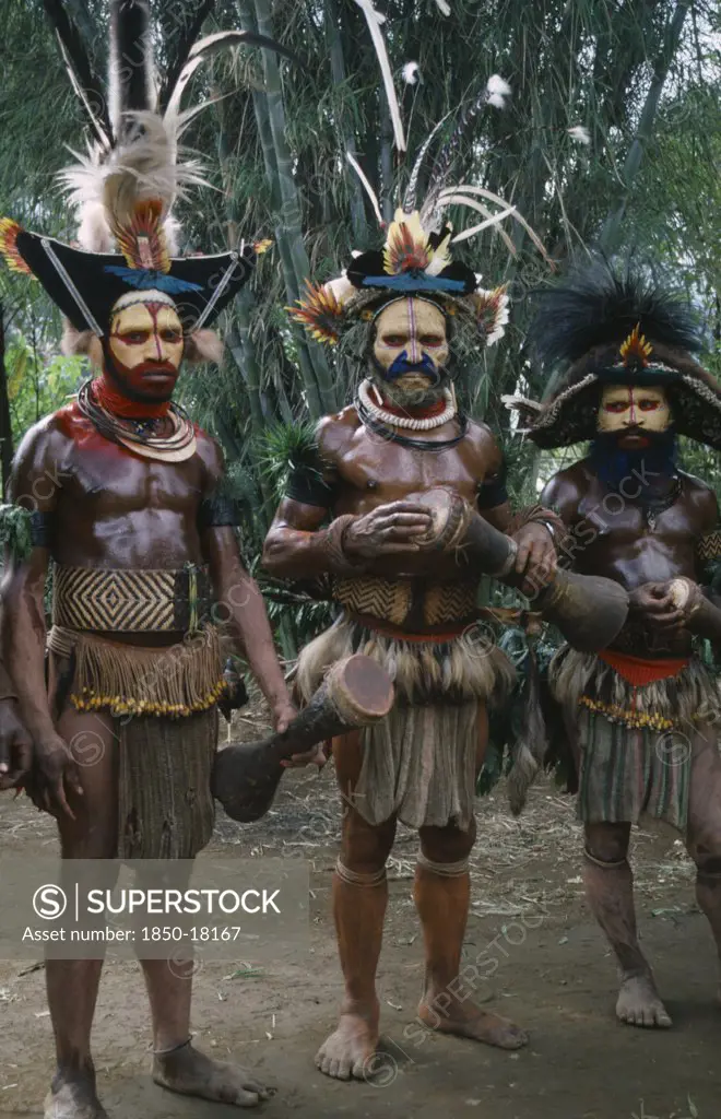 Pacific Islands, Melanesia, Papua New Guinea, Southern Highlands.Tari. Huli Tribemen In Traditional Costumes With Face Paint And Elaborate Feather Headdresses For Sing Sing Festival.