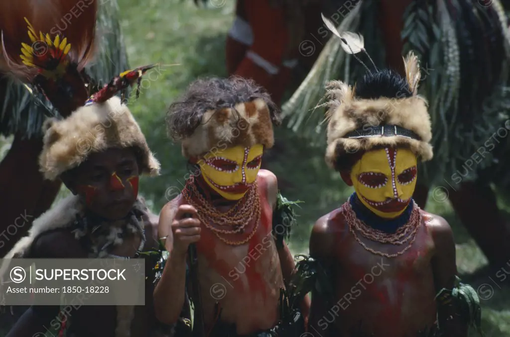 Pacific Islands, Melanesia, Papua New Guinea, Southern Highlands. Huli Tribe The Wigmen. Children In Costume With Painted Faces At Sing Sing Festival
