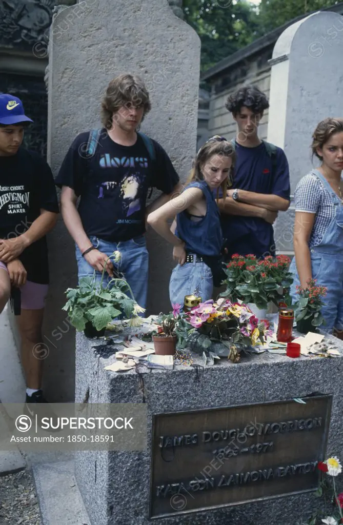 France, Ile De France, Paris, Pere Lachaise Cemetery. Visitors Surrounding Jim MorrisonS Grave