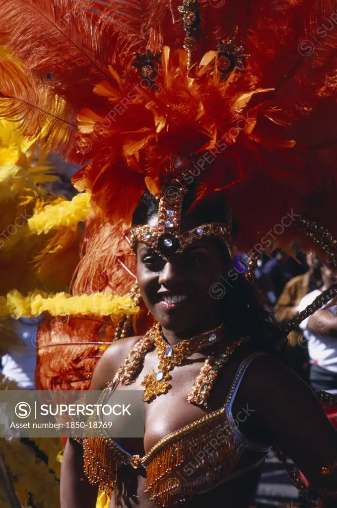 England, London, Notting Hill Carnival Female Reveller In Extravagant Costume