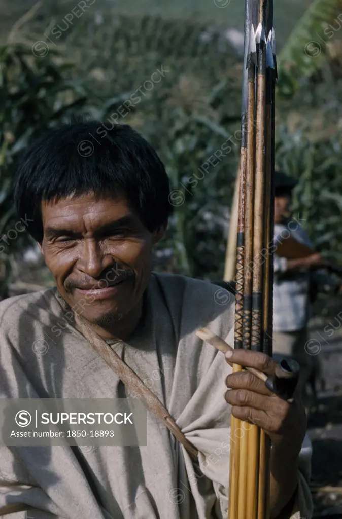 Colombia, Sierra De Perija, Yuko - Motilon ., 'Man Clutching Hardwood Bow And Quiver Of Steel-Headed Arrows For Mammals And Birds, Clay Pipe For Tobacco, Wearing Woven Cotton Manta  / Cloak.'