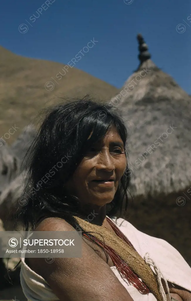 Colombia, Sierra Nevada De Santa Marta, Kogi Tribe, Portrait Of Older Woman Wearing Necklace Of Precious Red Glass Beads.