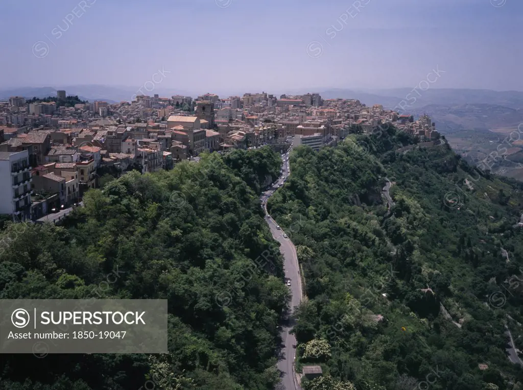 Italy, Sicily, Enna Province, 'A Road Leading To The City , View West Over The Rooftops From Castello Di Lombardia. The Highest Provincial Capitol In Italy'