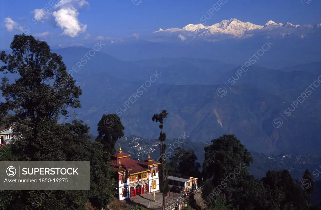 India, West Bengal, Darjeeling, 'Bhutia Busty Gompa And Mount Kanchenjunga Beyond The Buddhist Monastery, Which Houses The Original Copy Of The Tibetan Book Of The Dead, Looks Out Over The Himalayan Foothills And On To The Peaks Of The World'S Third Highest Mountain'