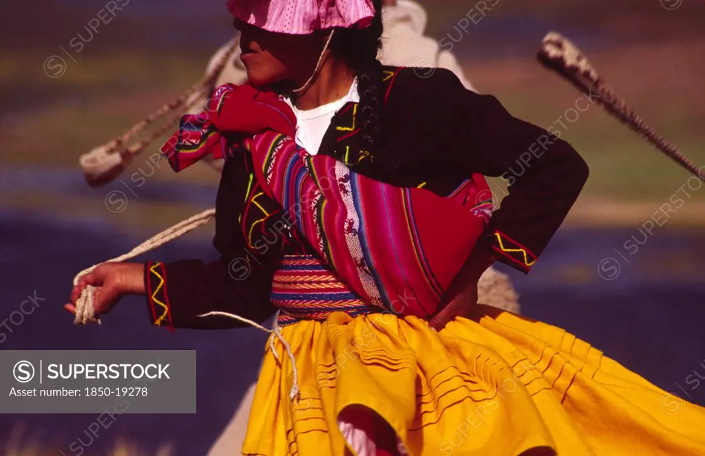 Peru, Puno Administrative Department, Lake Titicaca, 'Aymara Dancer Dressed In Her Traditional Costume, An Aymara Girl Performs A Folk Dance On The Shore Of Lake Titicaca'