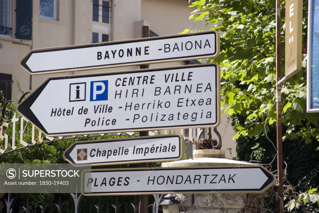 France, Aquitaine Pyrenees Atlantique, Biarritz, The Basque Seaside Resort On The Atlantic Coast. Bilingual Roadsign In The Centre Of The Town. French And Basque Language.