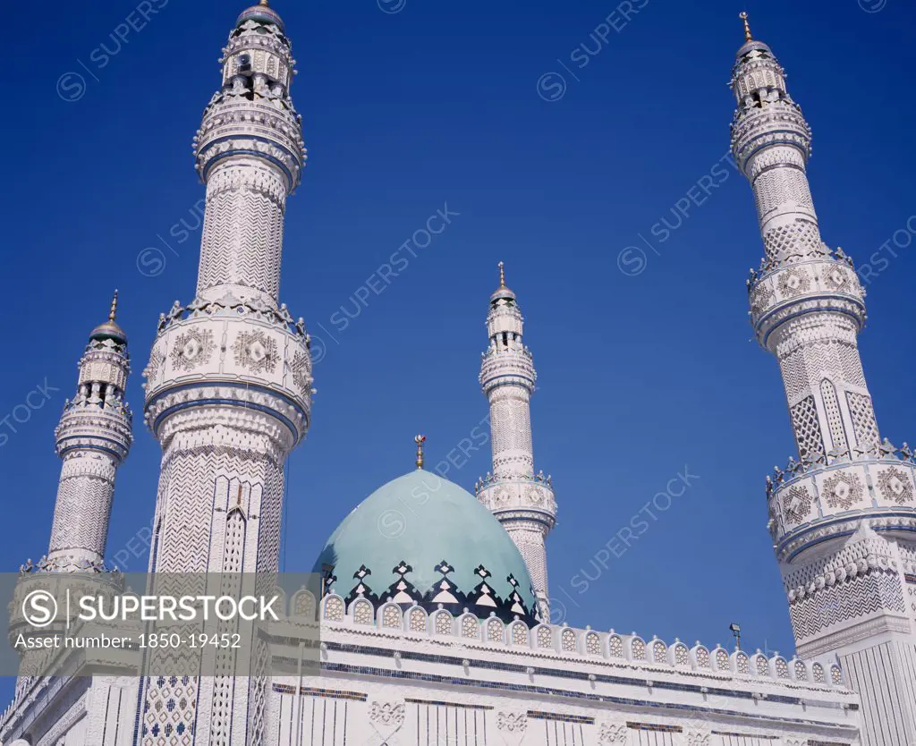 Kuwait, Kuwait City, Iranian Mosque.  Part View Of Highly Decorated Facade Of Mosque Showing Domed Roof And Four Minarets.