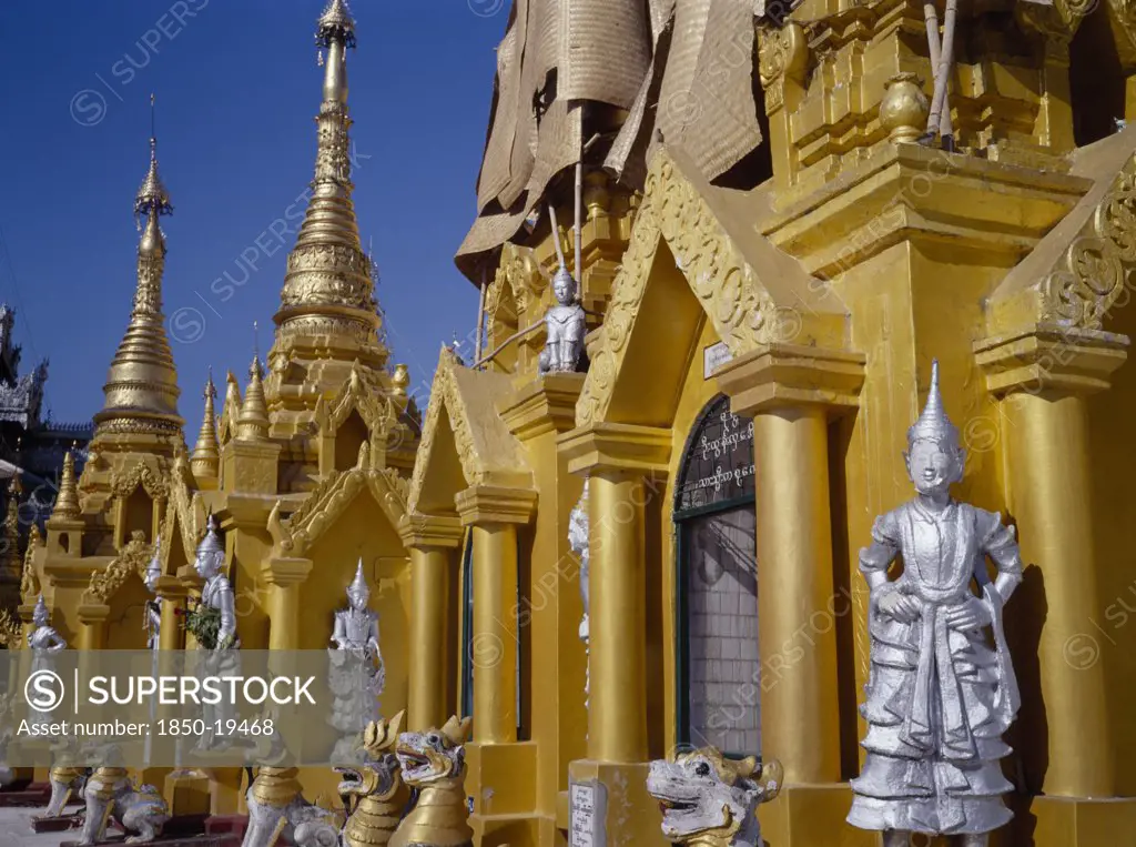Myanmar, Yangon, Shwedagon Paya.  Golden Shrines And Statues In Temple Complex.