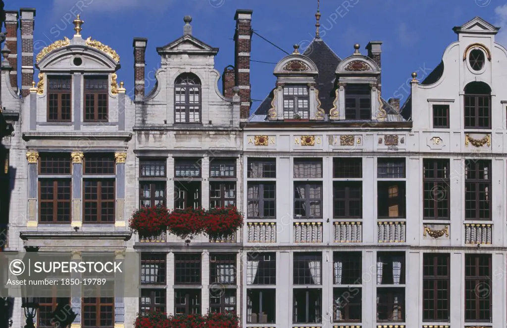 Belgium, Brabant, Brussels, Part View Of Building Facades With Gable Rooftops And Gilded Decoration  Balconies And Flower Filled Window Boxes.