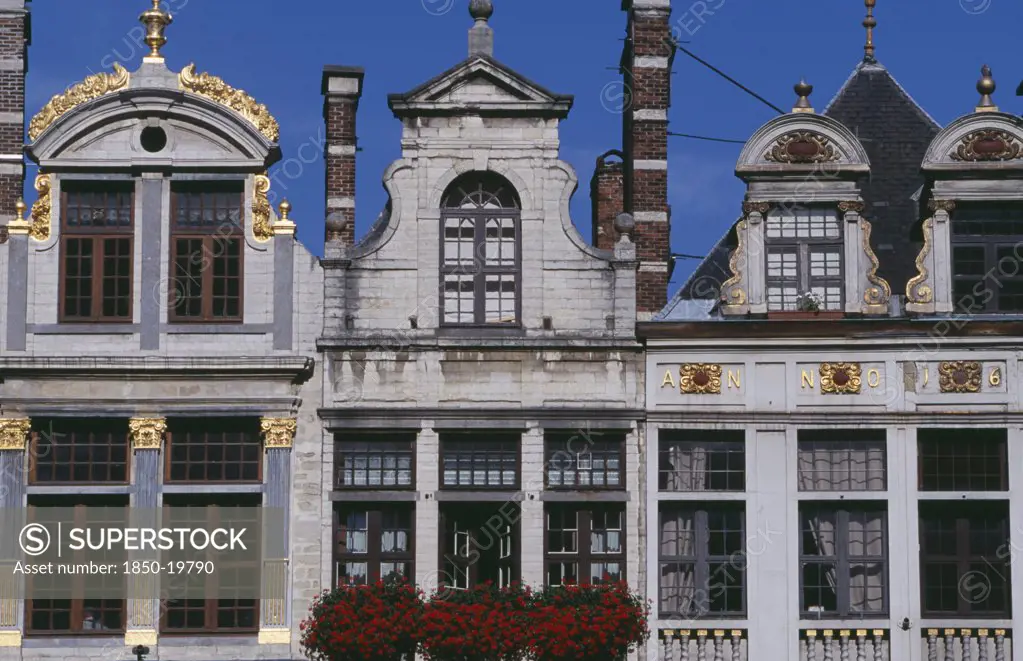 Belgium, Brabant, Brussels, Part View Of Building Facades With Gable Rooftops And Gilded Decoration  Balconies And Flower Filled Window Boxes.