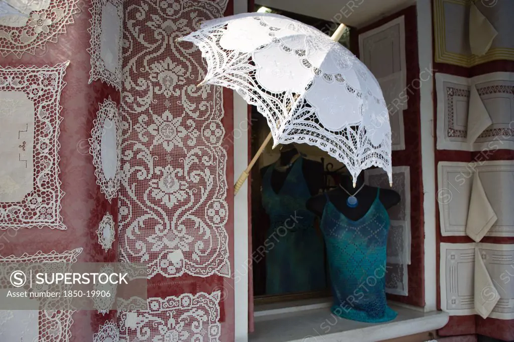 Italy, Veneto, Venice, 'Burano, One Of The Few Inhabited Islands In The Lagoon Famous For Traditional Lace Production. Shop Display Of Locally Made Lace'