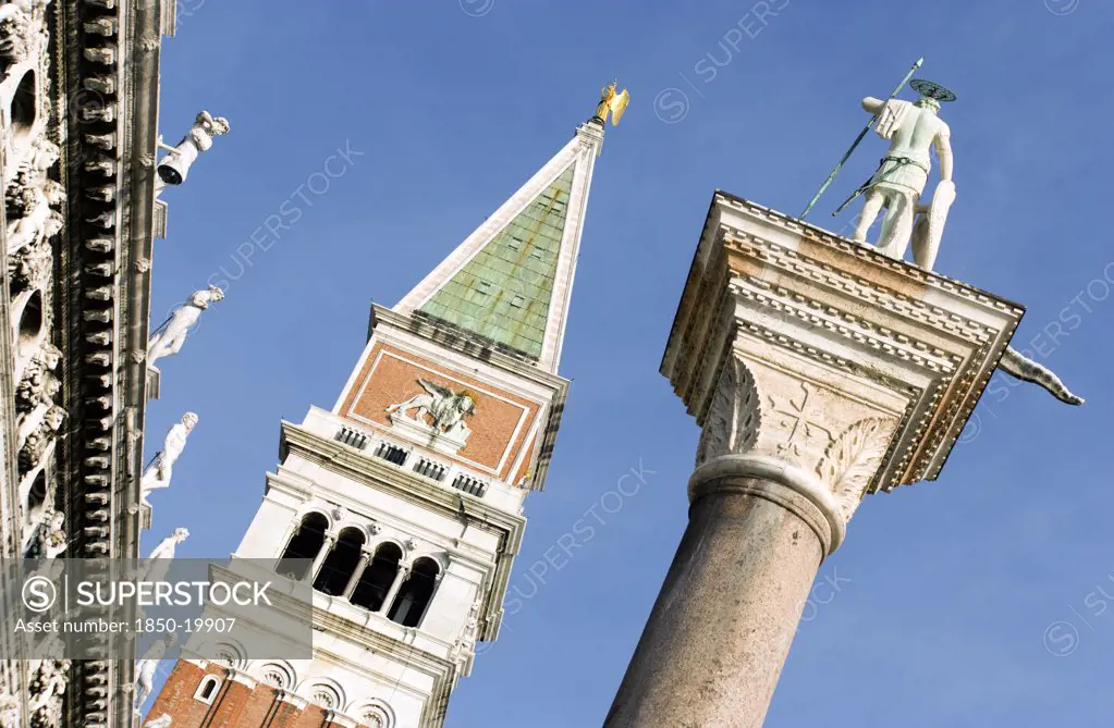 Italy, Veneto, Venice, 'The Campanile In St Mark'S Square With The Column Of San Teodoro, The Original Patron Saint Of Venice, On The Right'