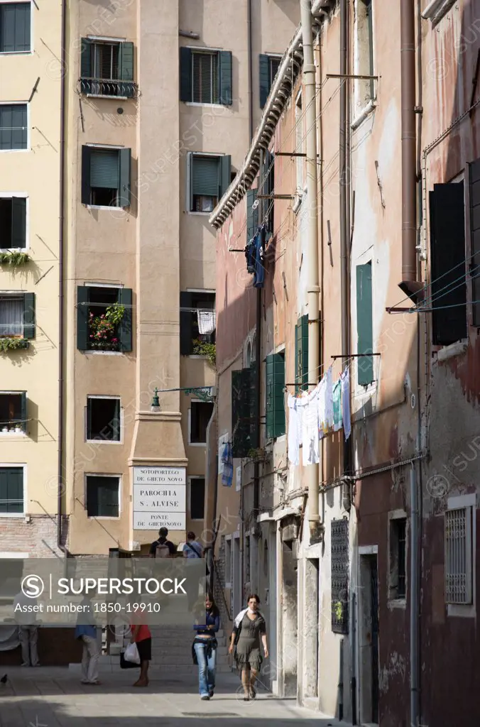Italy, Veneto, Venice, 'One Of The Three Entrances To The Jewish Ghetto In Cannaregio District. A Small Bridge, The Ponte De Gheto Novo, At The End Of A Narrow Street Leads Across A Canal Into The Ghetto'