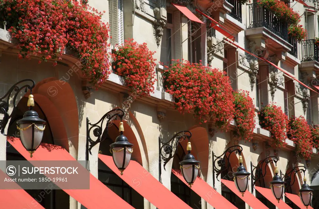 France, Ile De France, Paris, Red Geraniums Cascading Over The Balconies Of The Five Star Plaza Athene Hotel In The Heart Of The Haute Couture Fashion District In Avenue Montaigne