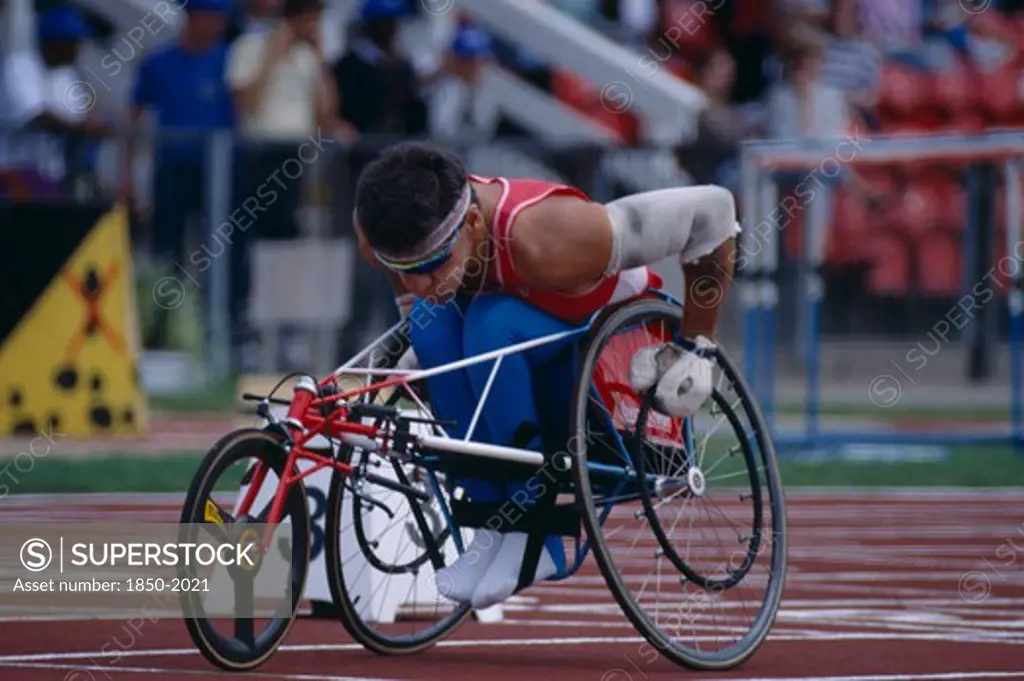 Sport, Athletics, Track, Disabled Athlete Lining Up The Front Wheel Of His Wheelchair On The Racing Track.