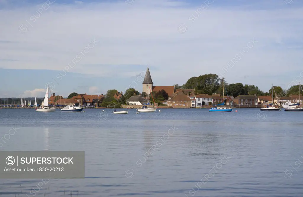 England, West Sussex, Bosham, View Across Water Toward Old Bosham With The Church Spire Visible