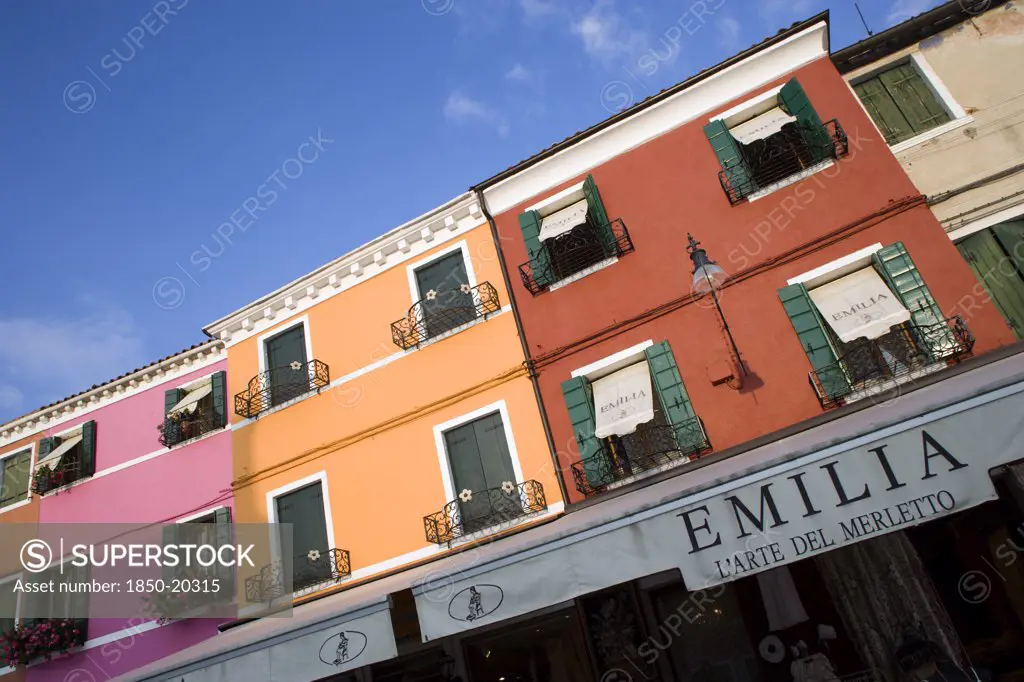 Italy, Veneto, Venice, 'Brightly Coloured Houses Above Lace Shops On The Lagoon Island Of Burano, Historically The Centre Of The Lace Making Industry In The Region'