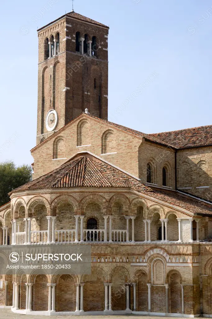 Italy, Veneto, Venice, The Colonnaded Exterior Of The Basilica Dei Santa Maria E Donato On The Canale Di San Donato On The Lagoon Island Of Murano