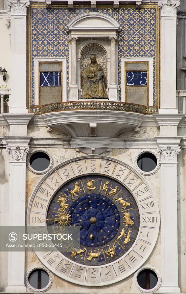 Italy, Veneto, Venice, The Madonna On The Torre Dell'Orologio Clock Tower Above The Ornate Clock Face Showing Signs Of The Zodiac And Phases Of The Moon