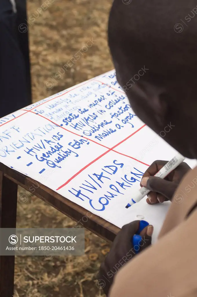 Uganda, Karamoja, Teacher at a workshop to raise awareness about HIV and AIDS prevention.