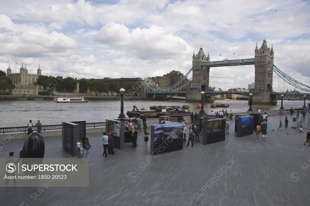 England, London, The Queens Walk Open Air Exhibition Outside The Gla City Hall With Tower Bridge Behind.