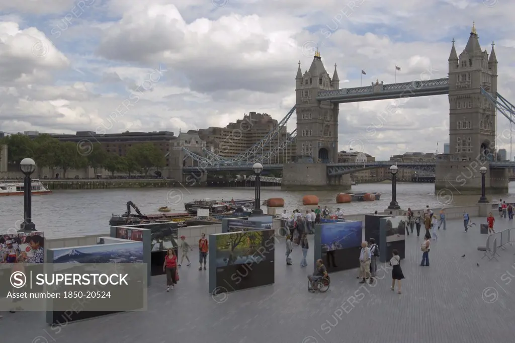 England, London, The Queens Walk Open Air Exhibition Outside The Gla City Hall With Tower Bridge Behind.