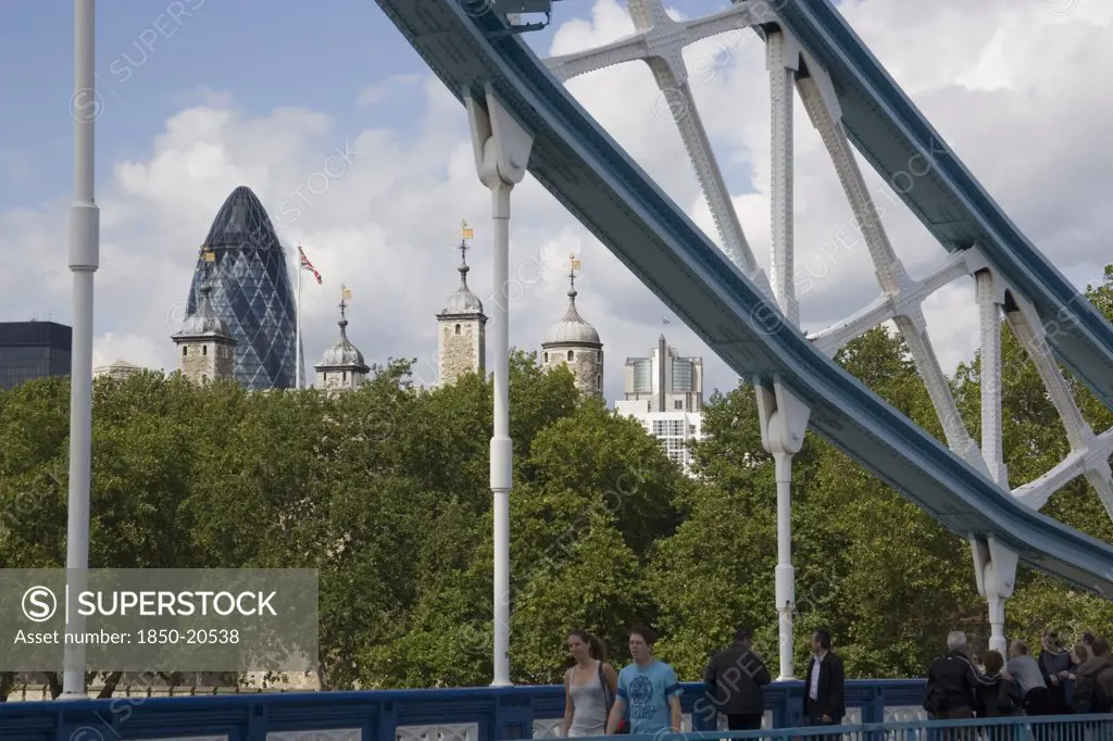 England, London, The Tower Of London And The Gherkin Seen Through A Detail Of  Tower Bridge.