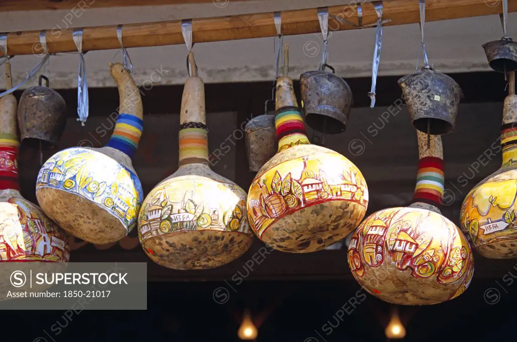 Bulgaria, Melnik., Colourful Gourds And Cattle Bells Hanging Outside Shop.