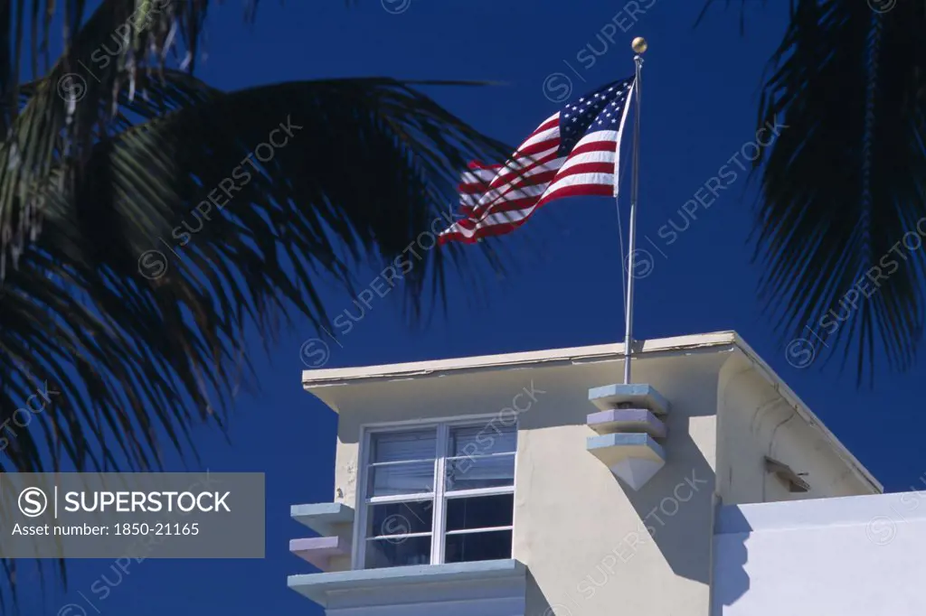 Usa, Florida, Miami, South Beach. Ocean Drive. Detail Of An Art Deco Building With An American Flag Flying From The Roof