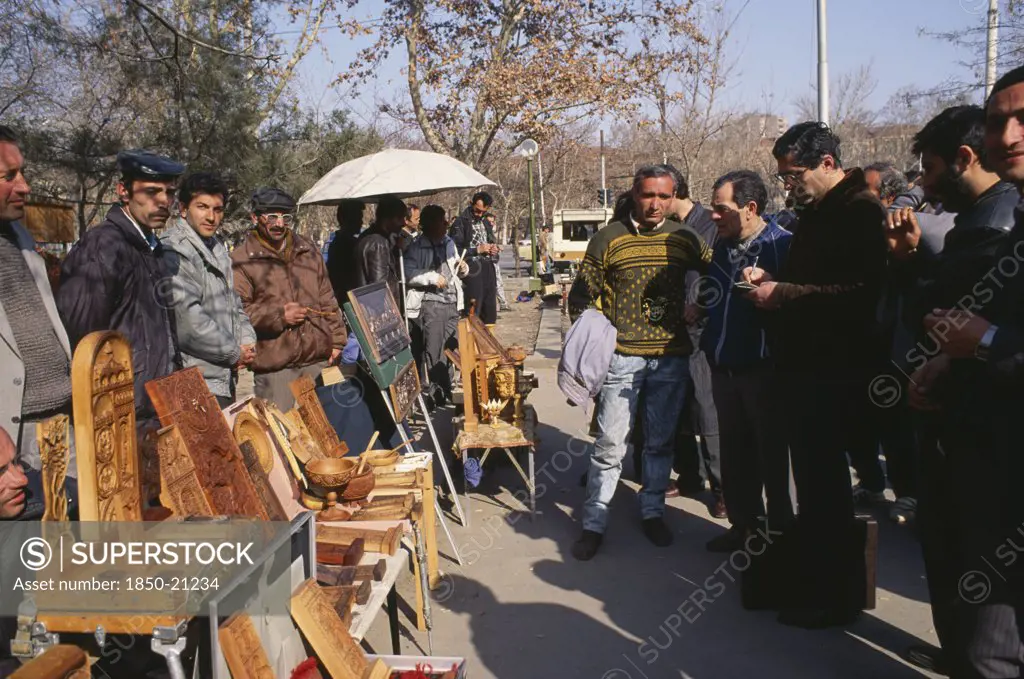 Armenia, Yerevan, Wood Carvings Including Cross Stones On Sale At Vernisarge Weekend Market.