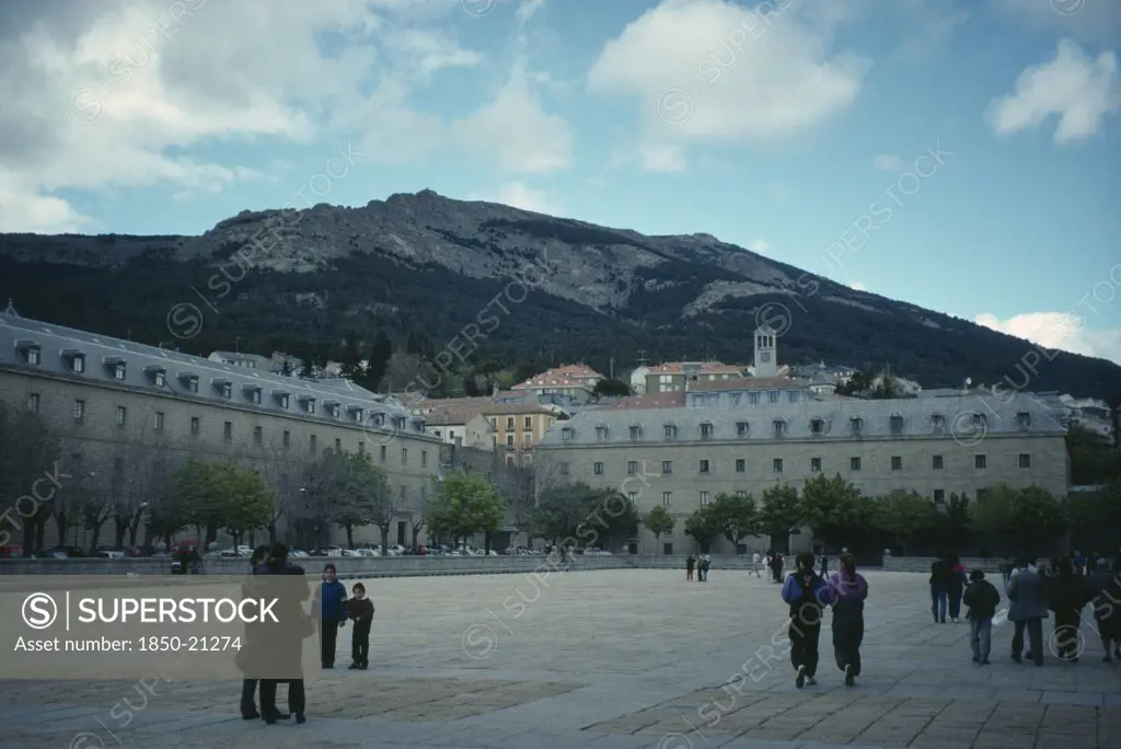 Spain, Madrid, El Escorial, Royal Monastery Of San Lorenzo De El Escorial.  Sixteenth Century Palace And Monastery Built During The Reign Of Phillip Ii.  Exterior With Tourist Visitors In Foreground.