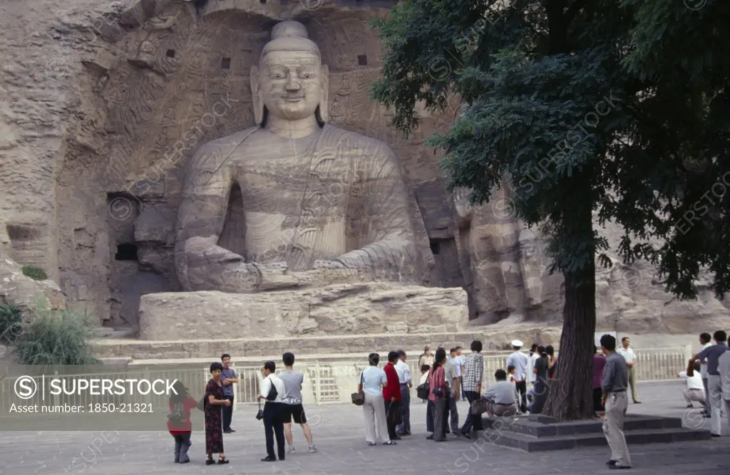 China, Shanxi, Datong, Yungang Caves.  Chinese Visitors At Ancient Buddhist Site With Rock Carvings Dating From Ad 386 - 534.