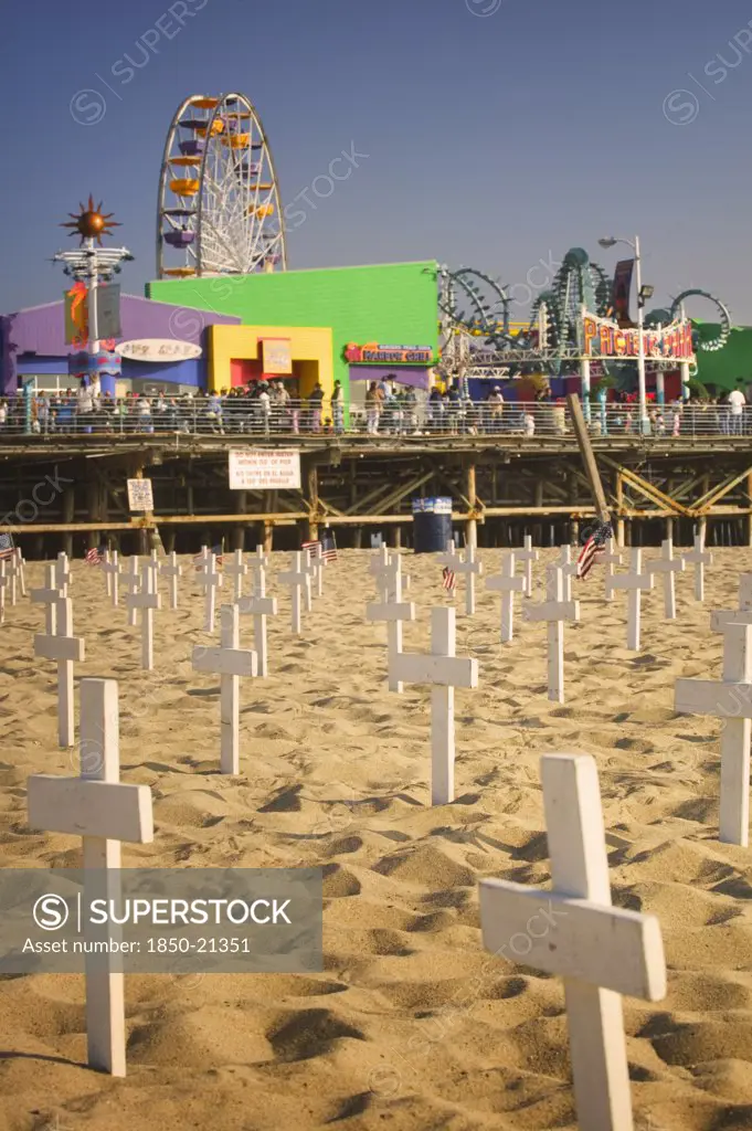 Usa, California, Santa Monica, A Graphic Protest Against The War In Iraq Beneath Santa Monica Pier. Each White Cross Represents A Member Of The American Armed Forces Who Has Lost Their Life.